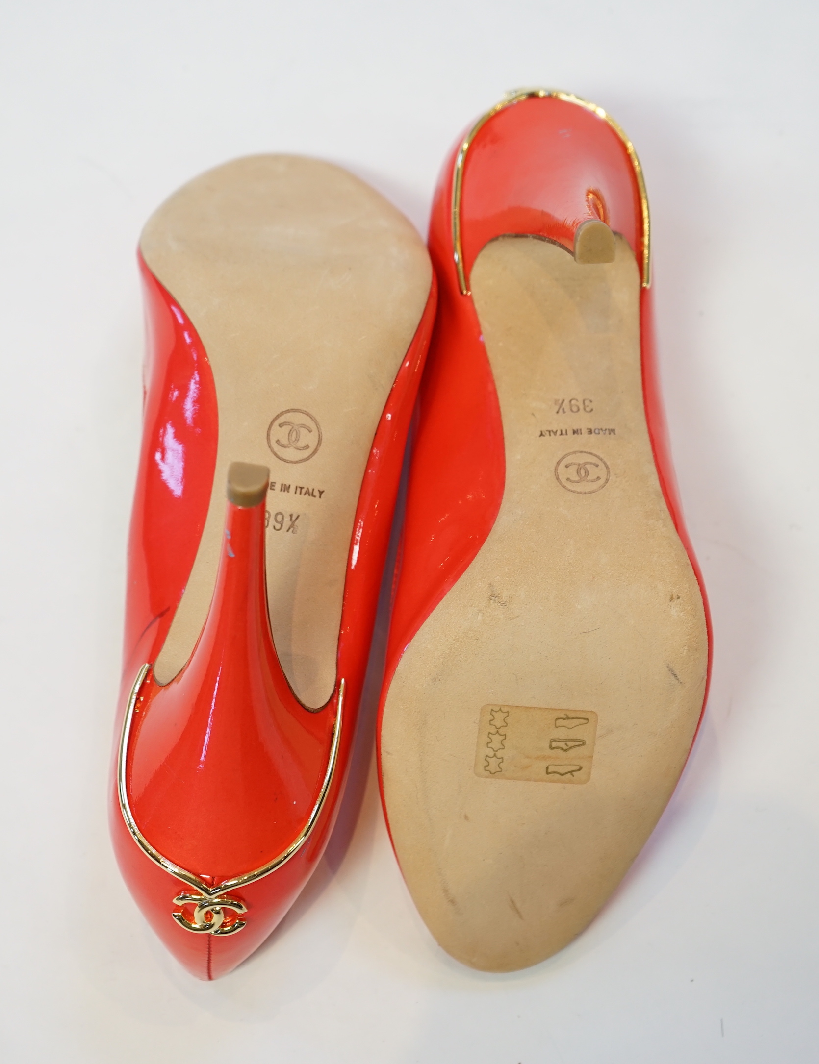 A pair of Chanel lady's metallic coral peep toe patent leather heels, size EU 39.5